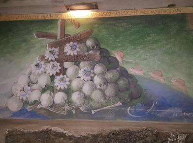 Mural with skulls, gentian flowers, mice, and signs reading “Adieu” and “Ad Drun”, signed in 2001.